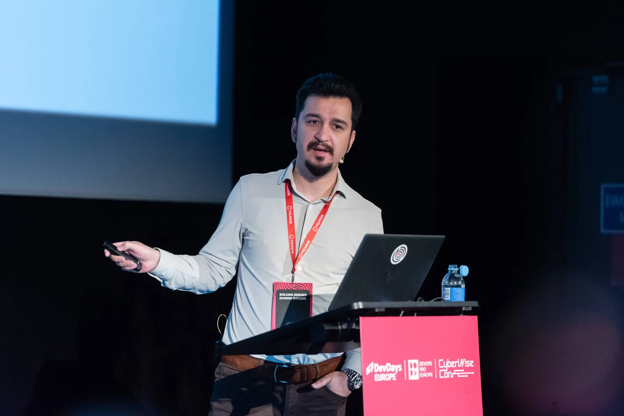 Halil İbrahim Kalkan speaking on stage at DevDays Europe 2025 in Vilnius