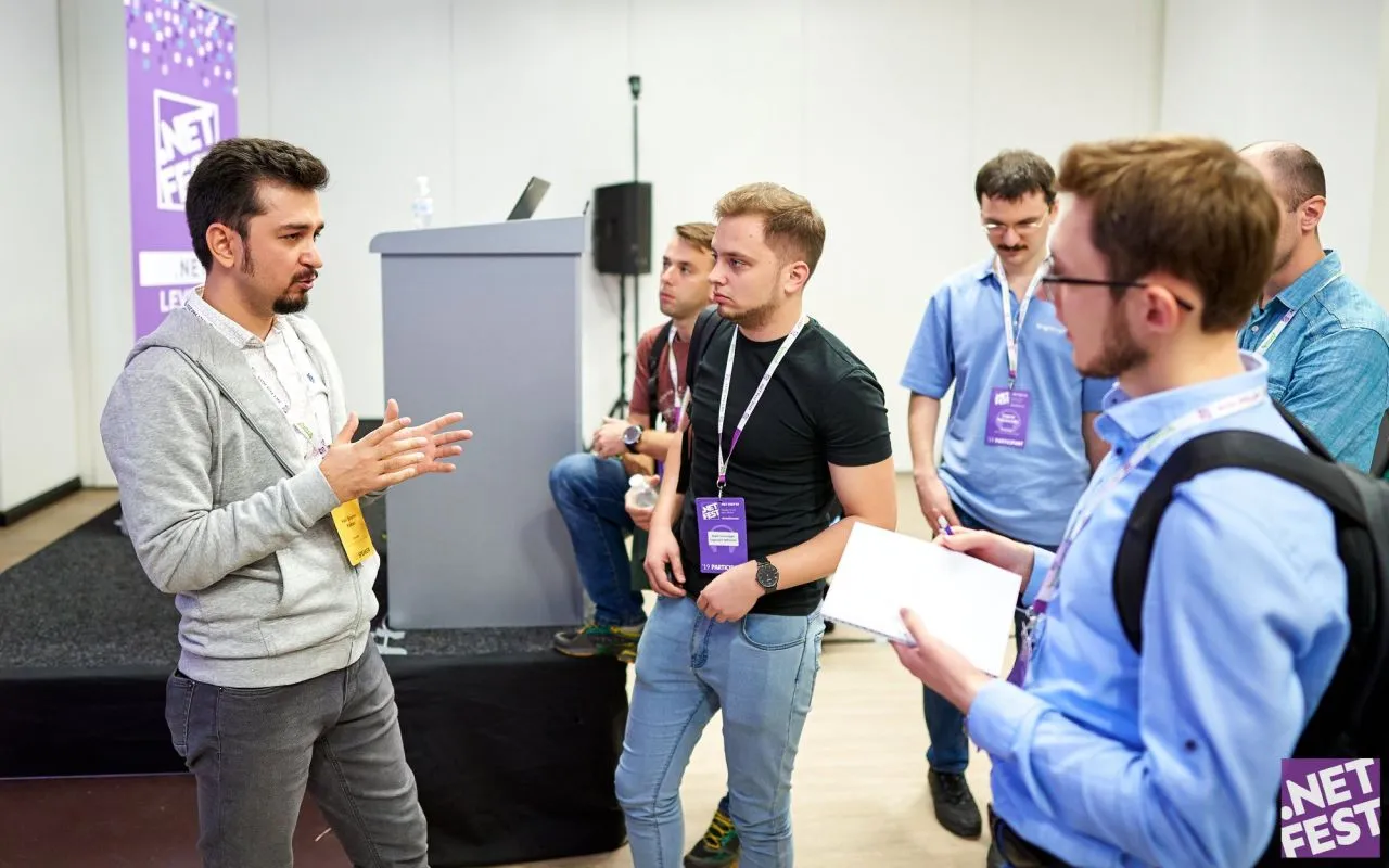 Halil İbrahim Kalkan talking with attendees after a session at .NET Fest